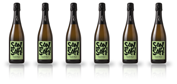 Six bottles of Saysah Organic Brut standing in a row