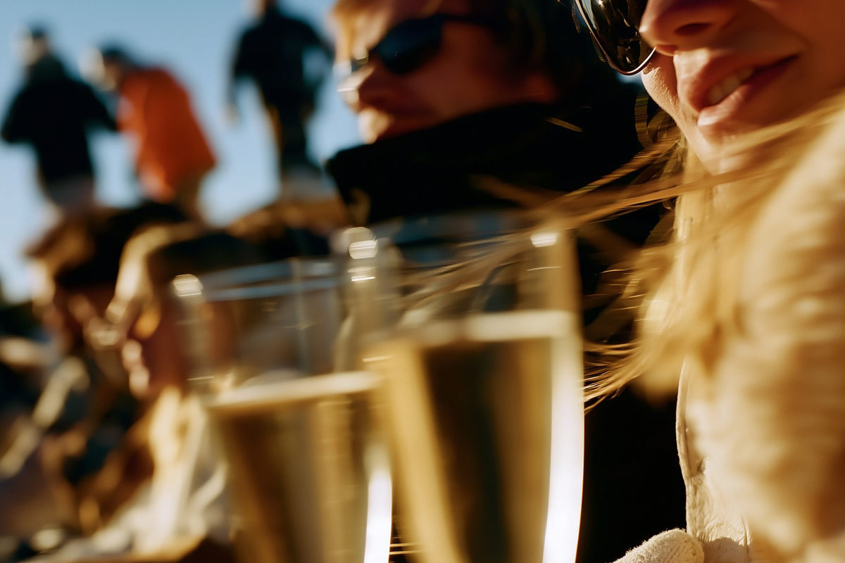 Two freshly poured glasses of sparkling wine at a gathering