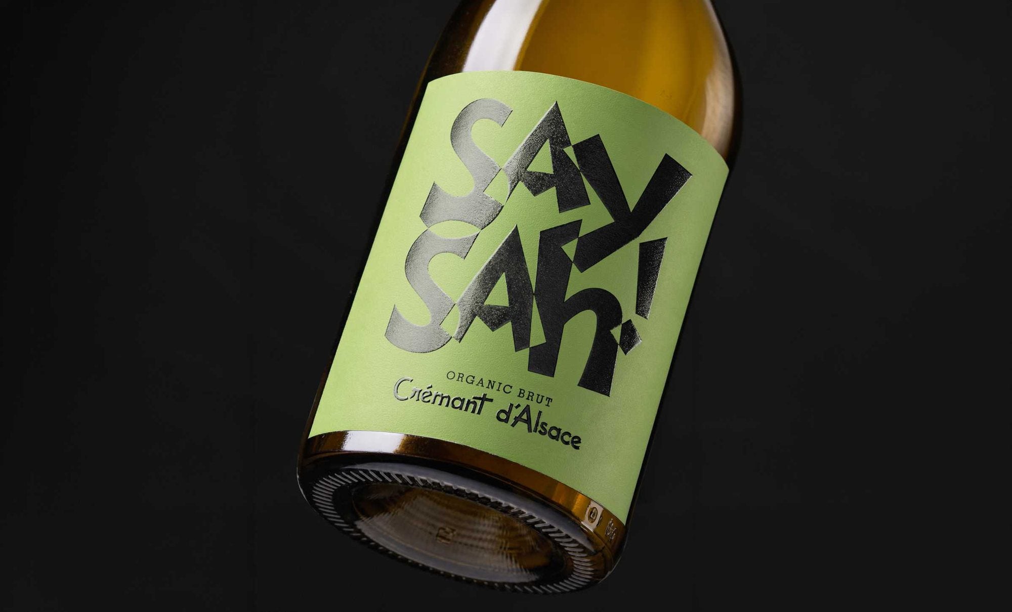 A bottle of Saysah organic Crémant d'Alsace with its green label